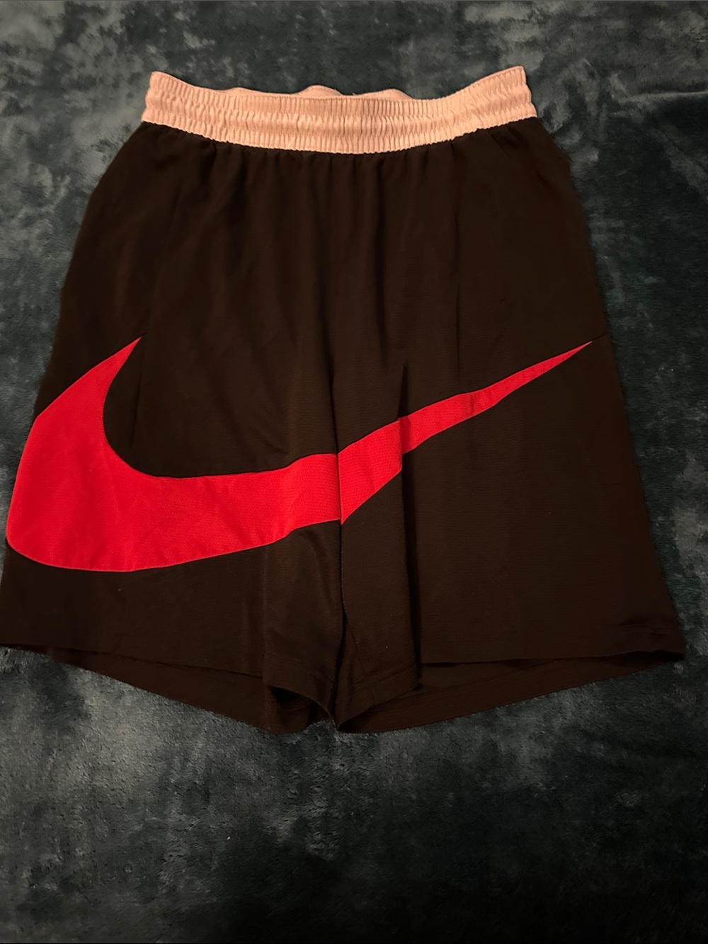 Nike Men's Black Athletic Shorts with Red Swoosh and White Waistband